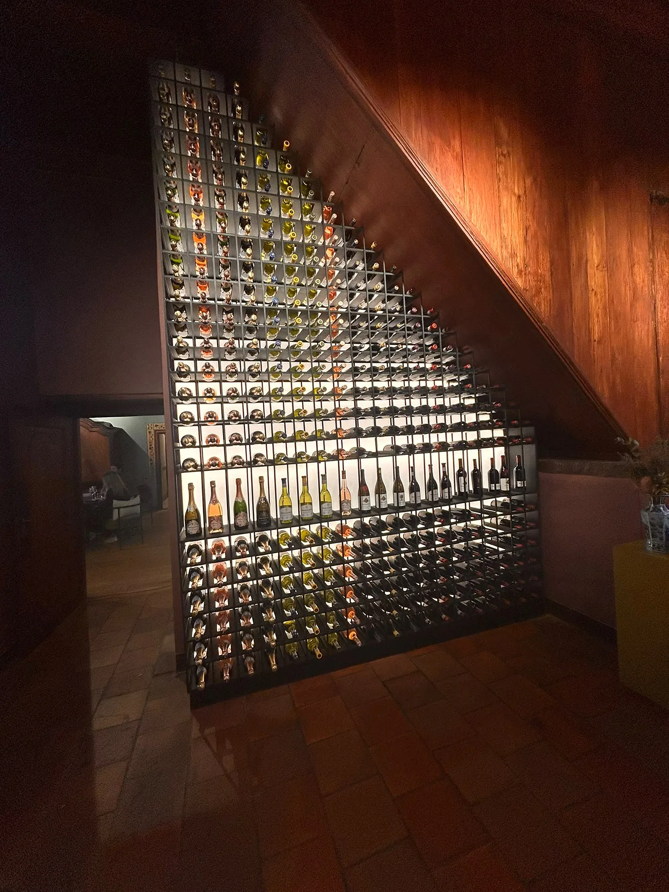 A lit wine wall at a wine estate